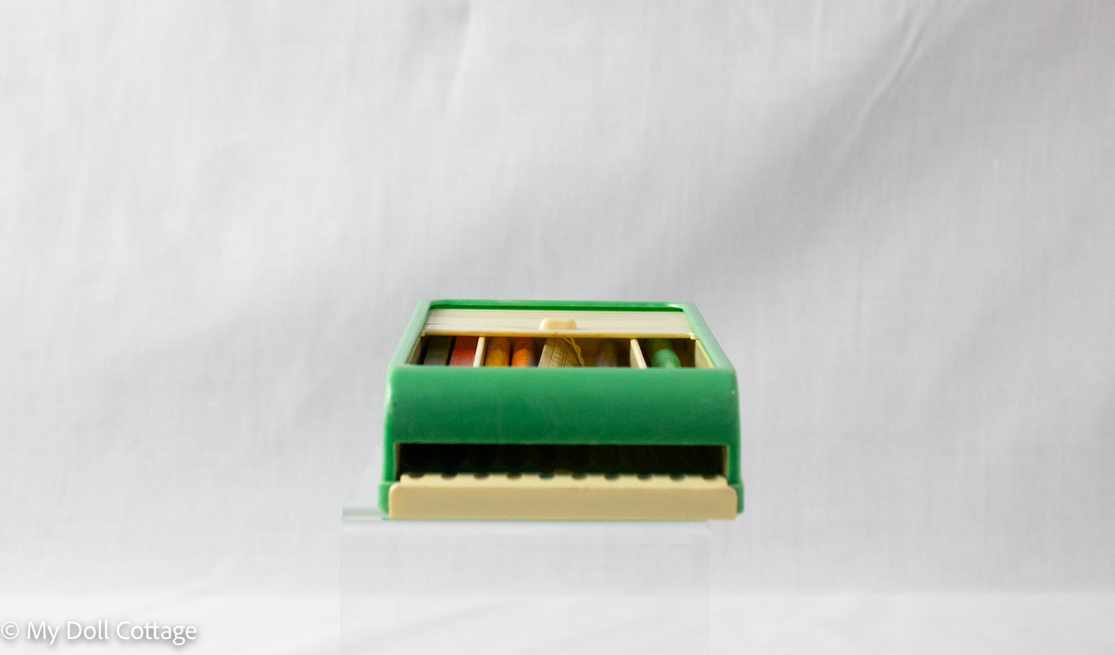 Vintage Rolinx Products green and cream sliding pencil case, closed with cream ridged panel, made in England