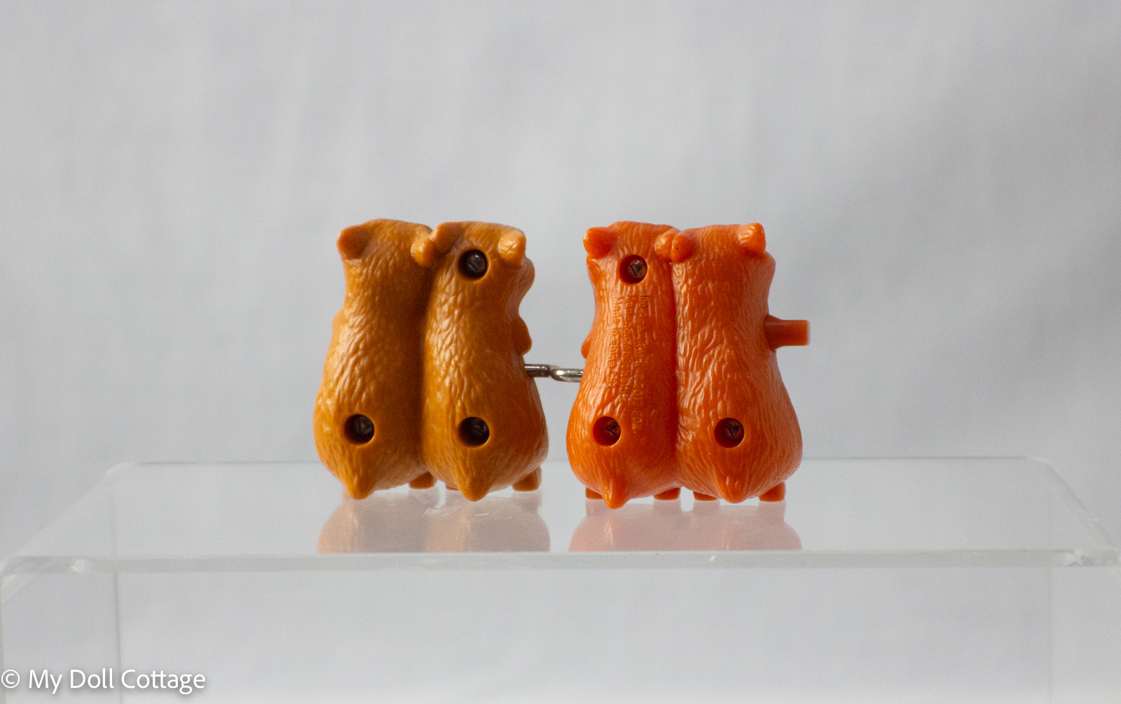 Rear view of the wind-up chipmunks showing screws and wind-up mechanism
