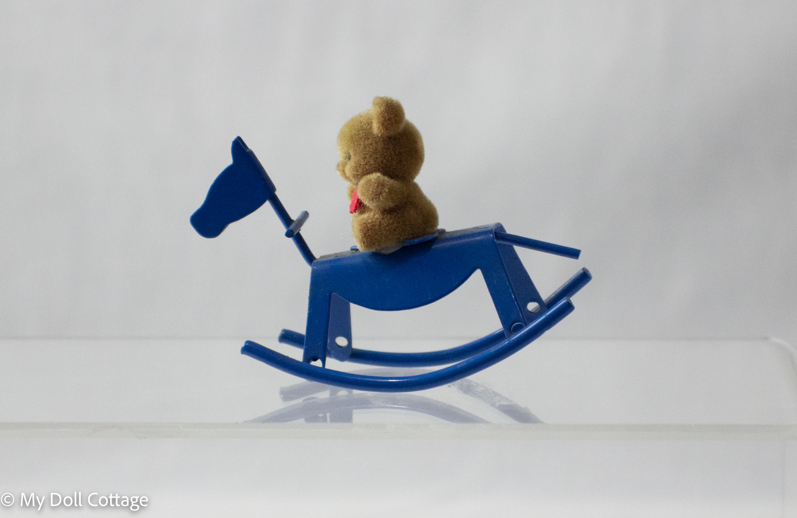 Vintage 1980s Miniature Teddy Bear on Blue Metal Rocking Horse