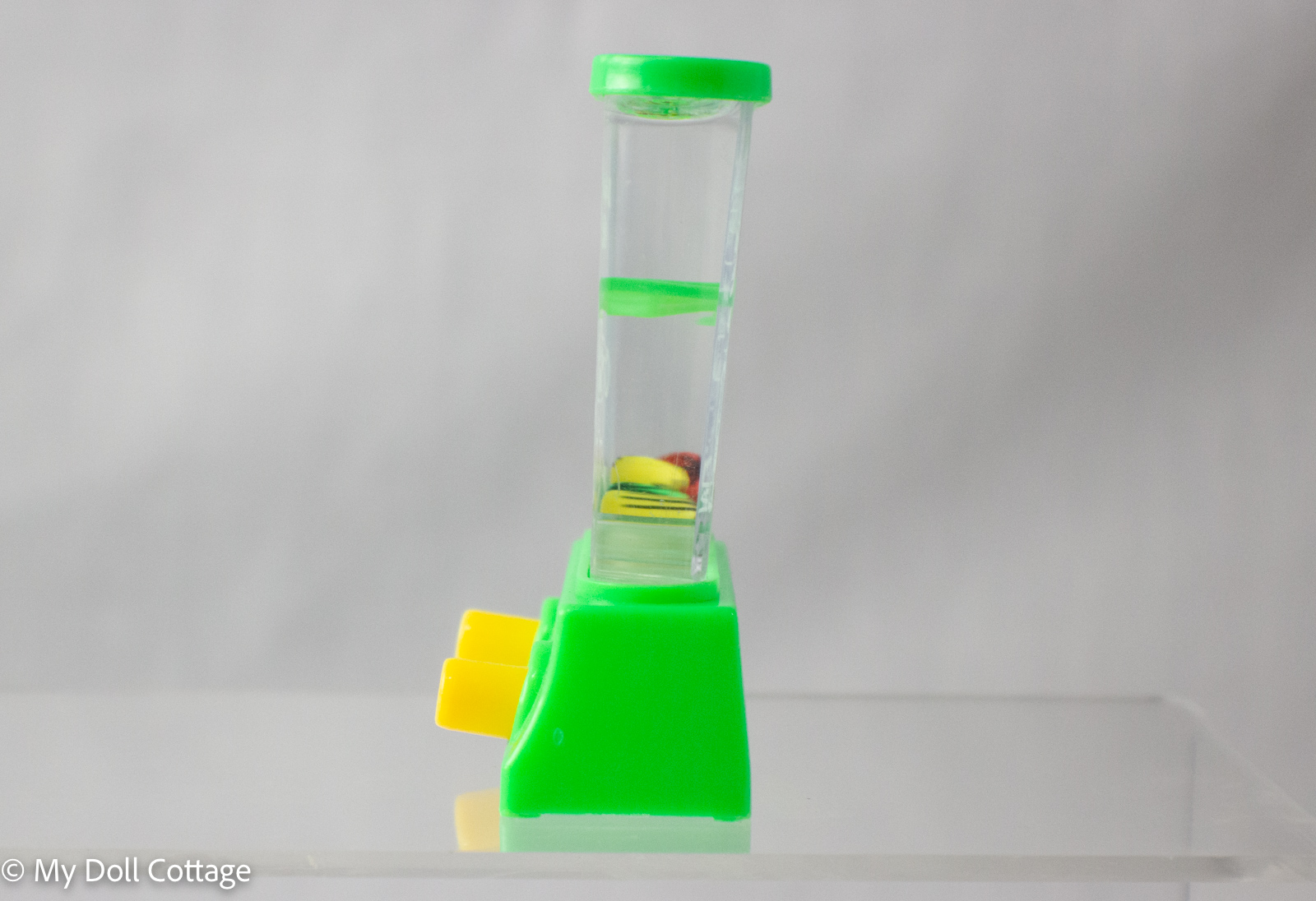 Side profile of the push-water water game, highlighting clear chamber and game mechanics.
