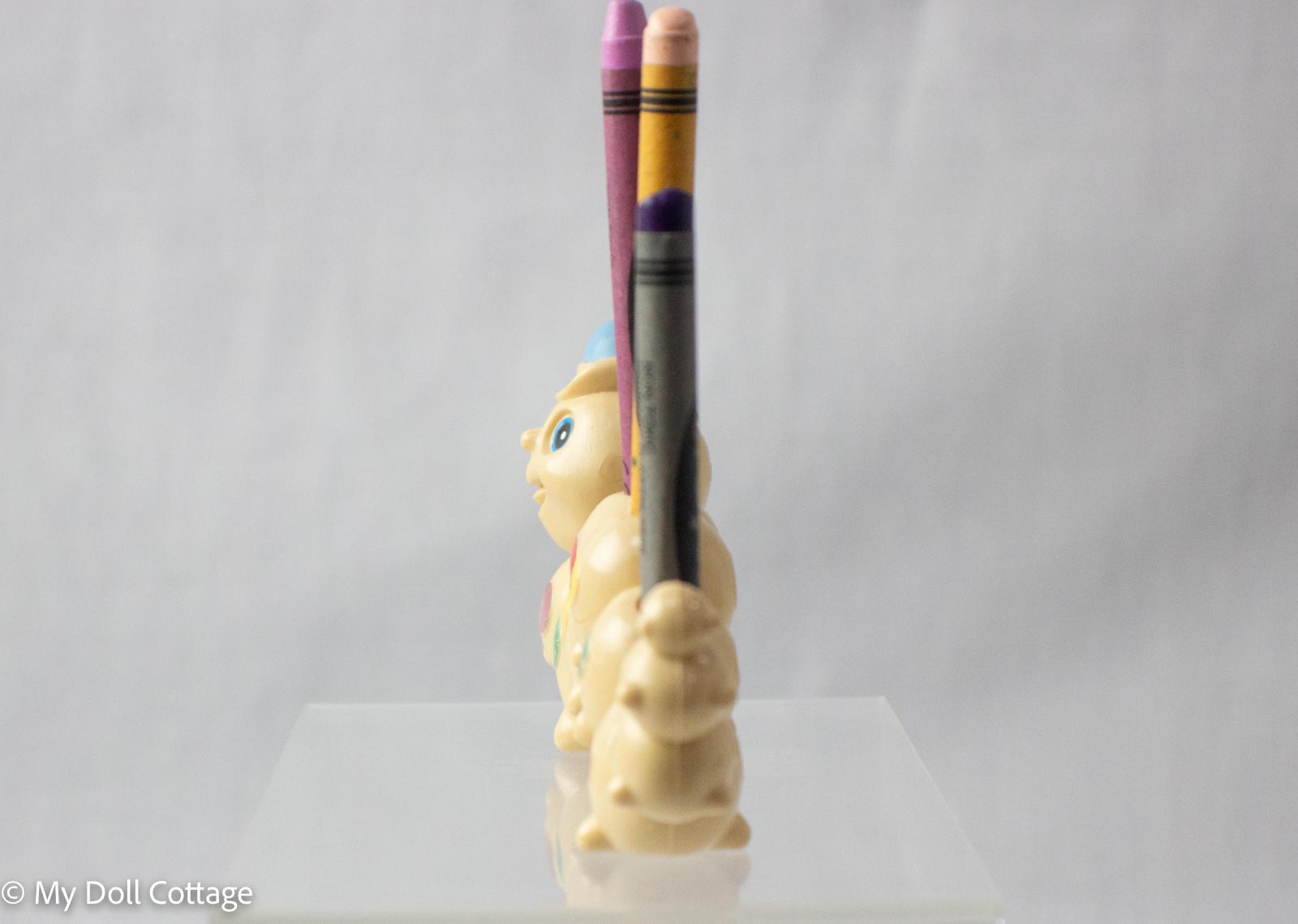 Side view from back showing crayon slots and tail section.