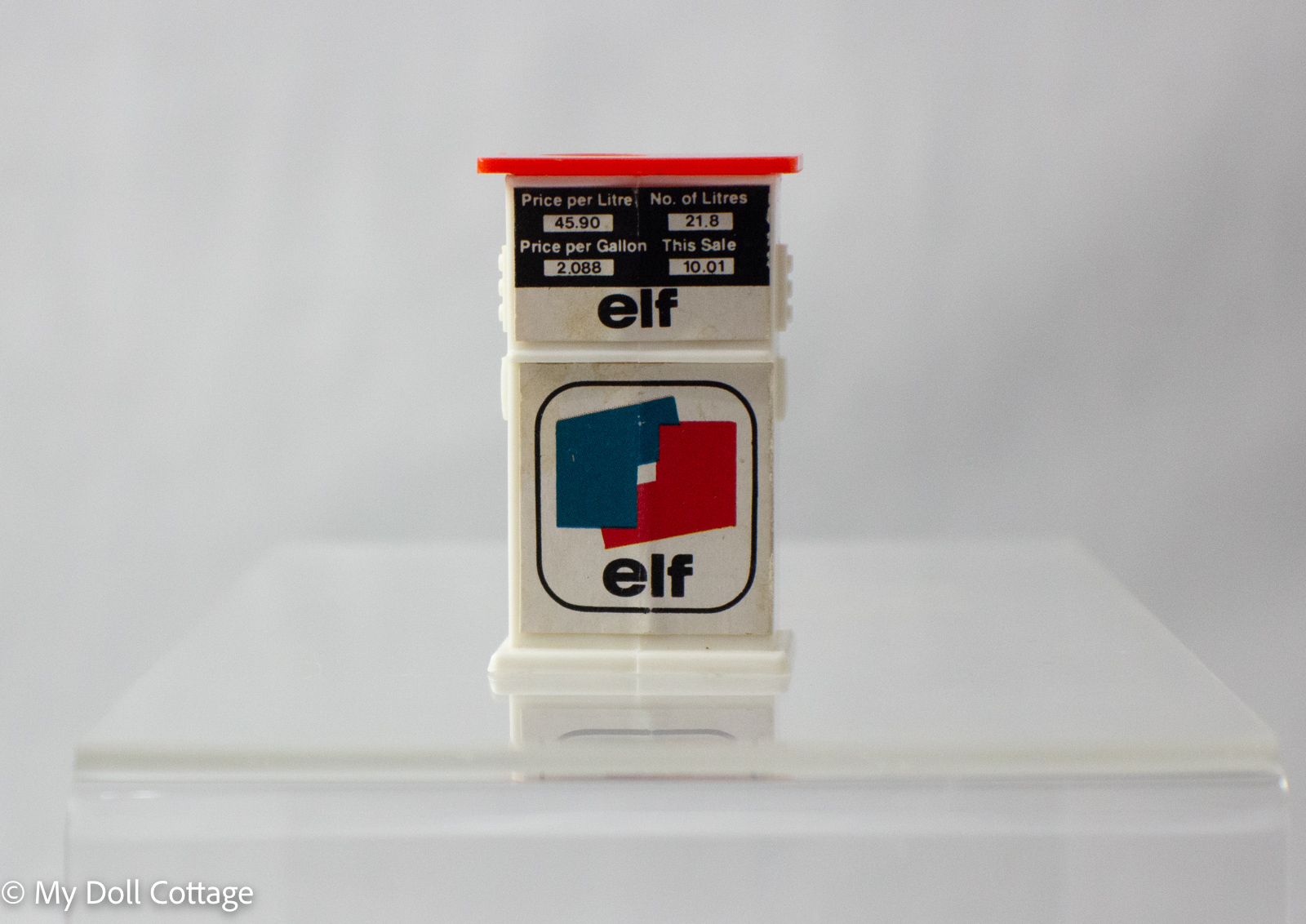 Alternate front angle of Elf petrol pump sharpener with logo and stickers visible.