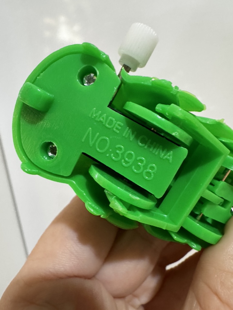 Markings on base for wind up caterpillar