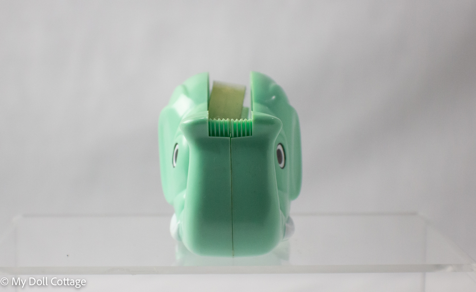 Front view of elephant tape dispenser showing trunk with tape cutter teeth.