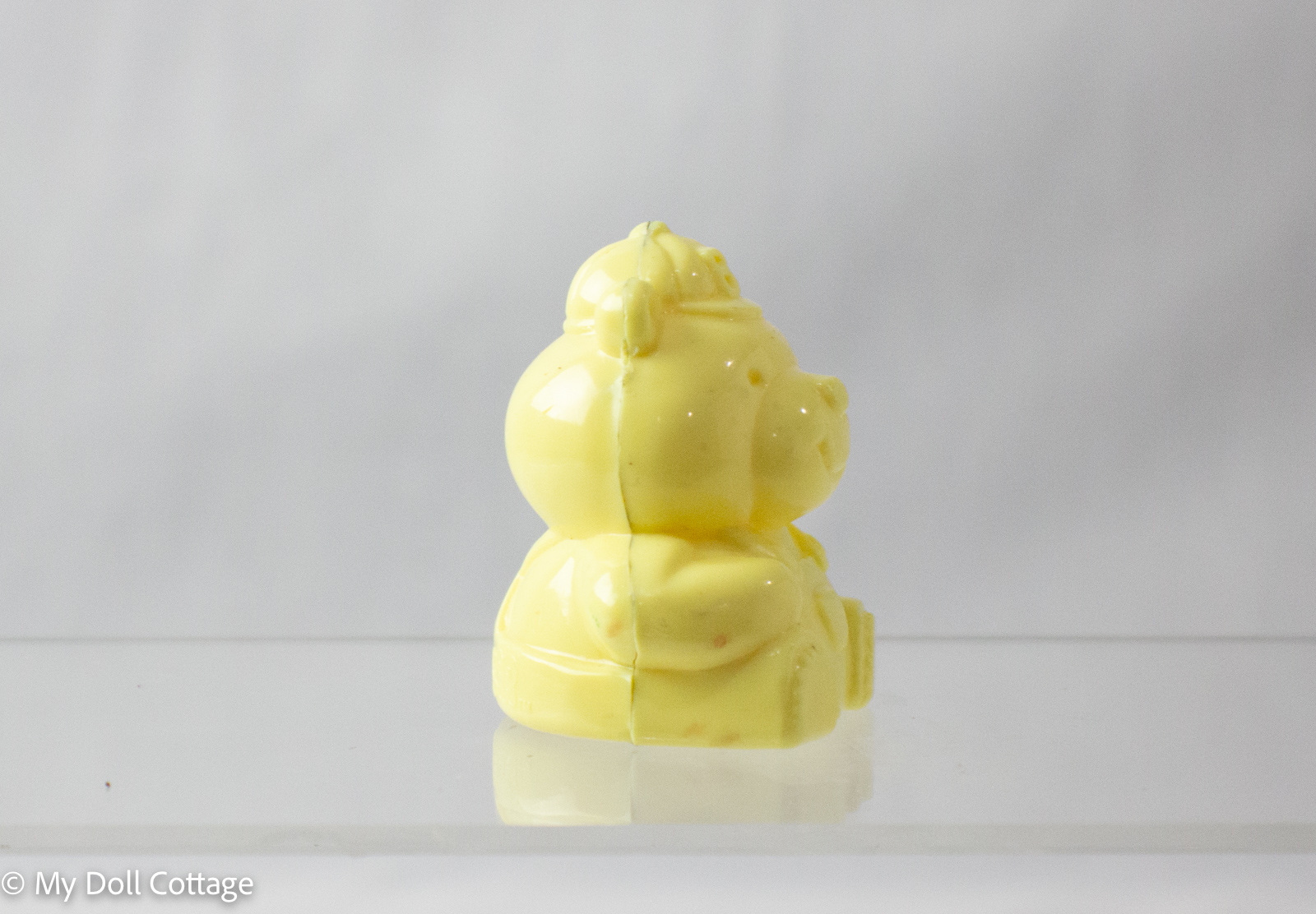 Side view of yellow Bearnie the Bear sharpener showing profile details.