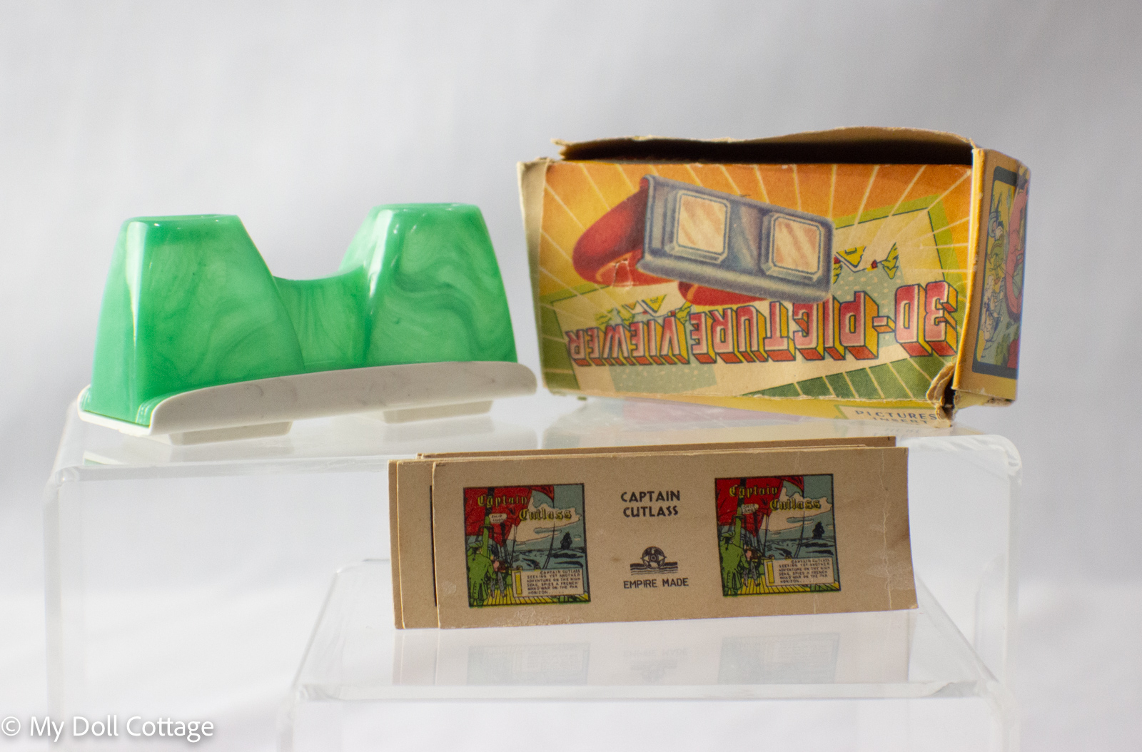 Empire Made 3D Picture Viewer with stereoscopic cards labelled Captain Cutlass in front of original yellow and red box.