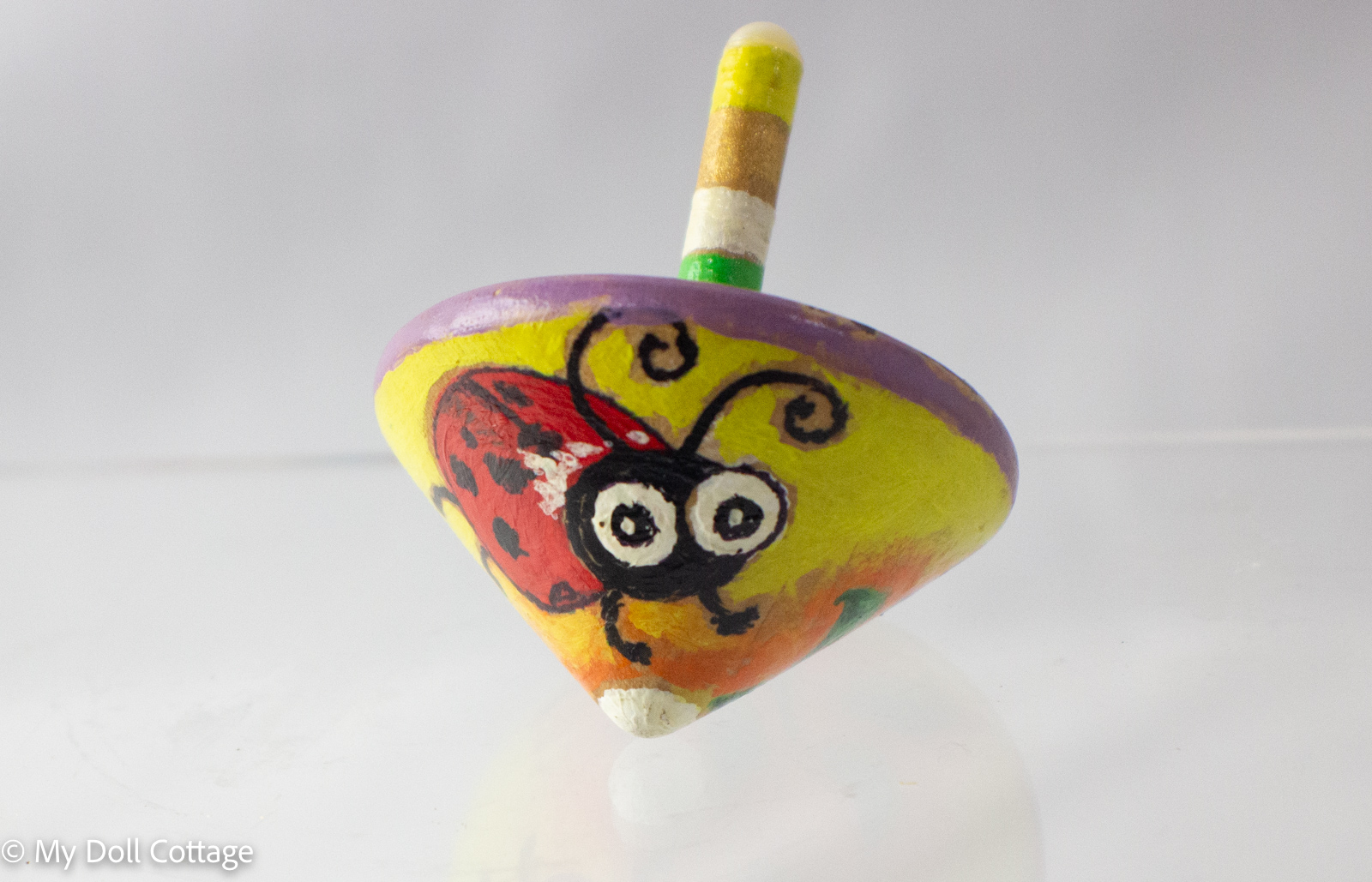 Wooden Spinning Top with Ladybug Design