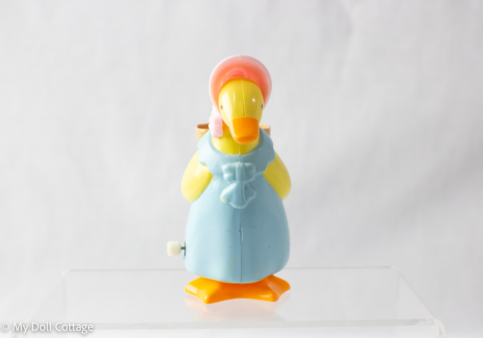 – Front view showing bonnet and bow detail.