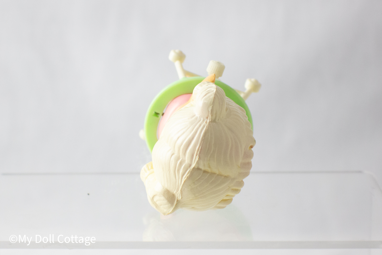 Overhead view highlighting the sculpted hair detail and top of the green walker