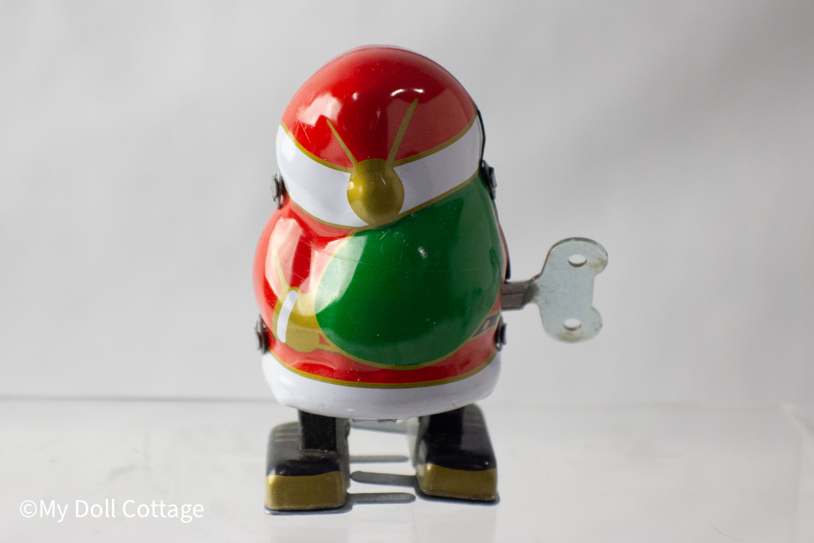 Rear view highlighting Santa’s green sack and vibrant lithography.
