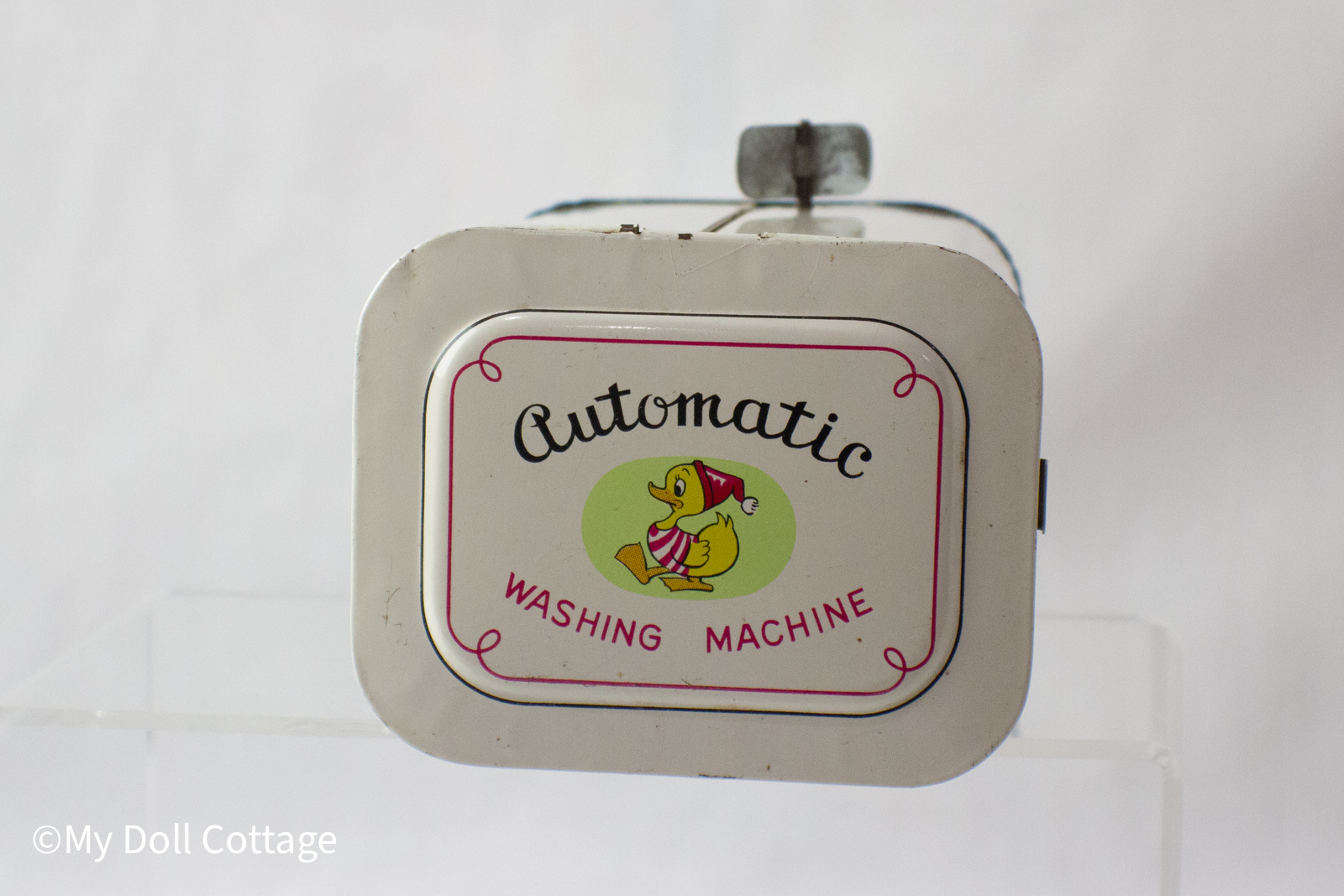 6.	Top panel reading “Automatic Washing Machine” with a duck illustration.