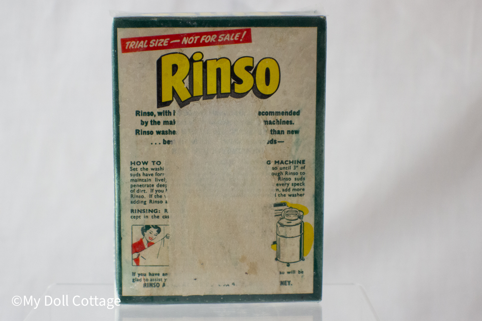 Back of the Rinso packet displaying washing instructions and faded printed text.
