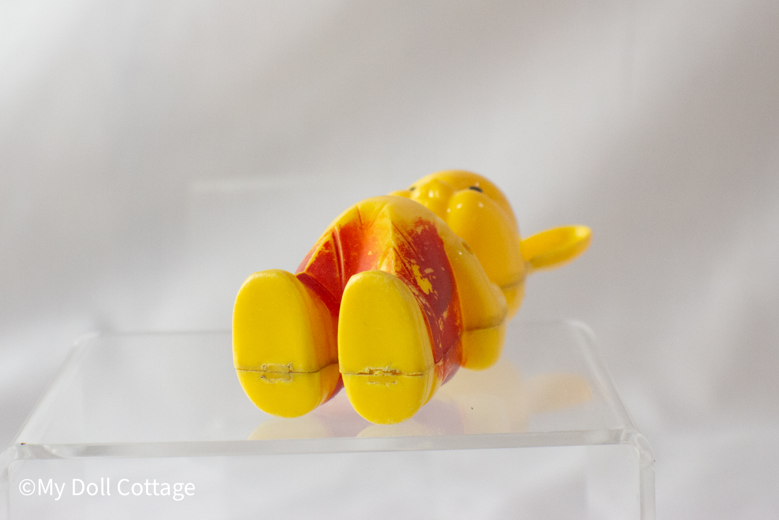 Bottom view showing yellow soles and seam lines. 