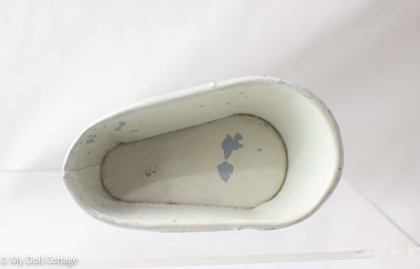 Top view showing white interior and signs of age and repainting.