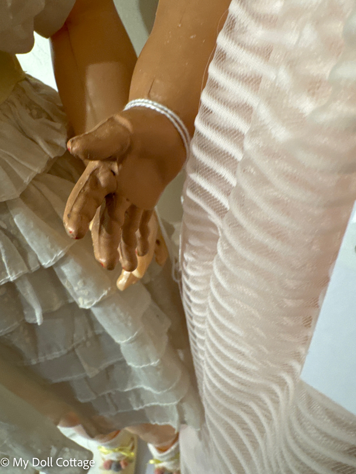 Close-up of hands showing minor wear and paint loss