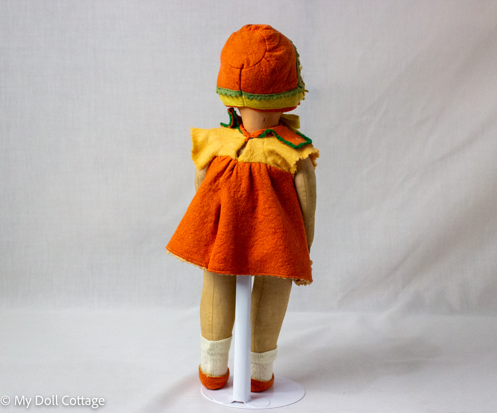 Rear full-length view displaying original costume construction and cloth body proportions.