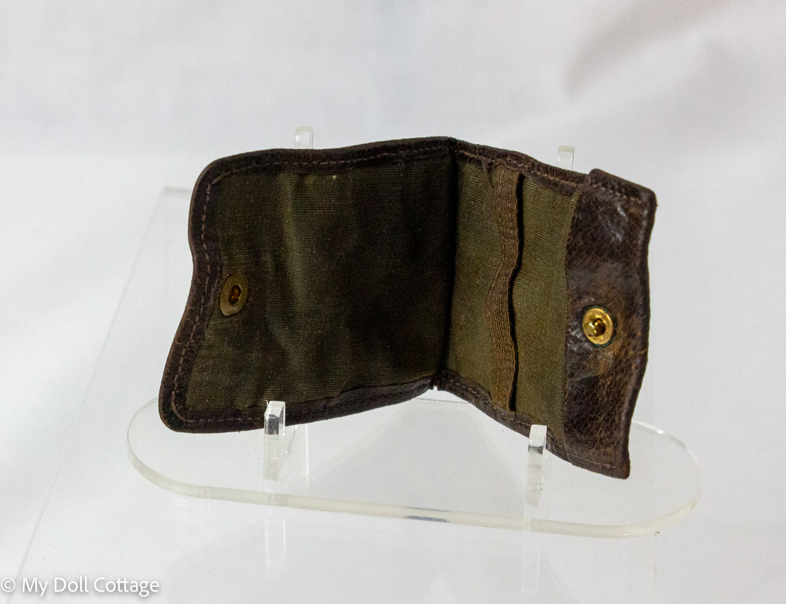 3. Open antique stamp wallet showing fabric-lined concertina interior compartments.