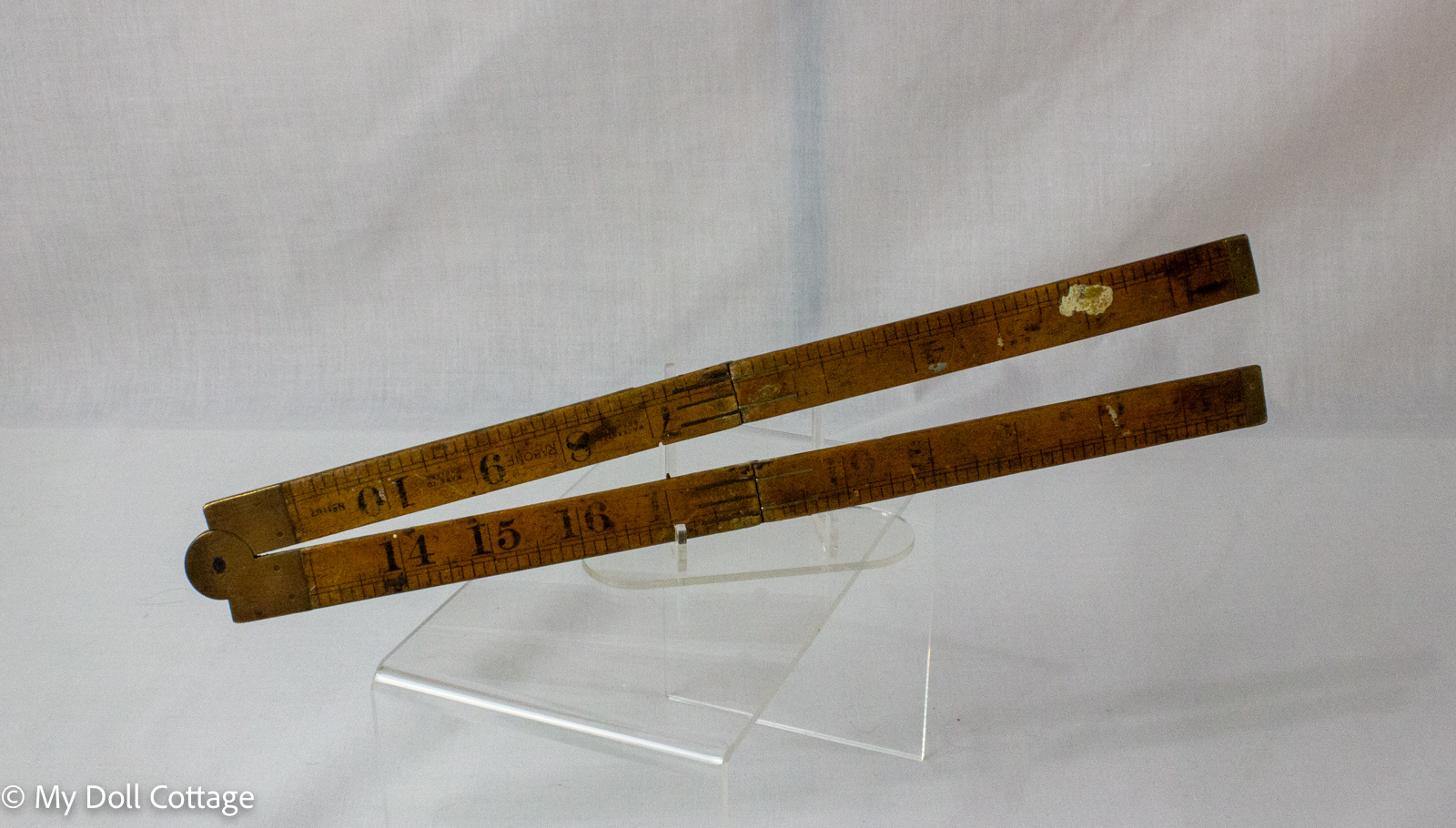 3. Fully extended 24-inch boxwood folding ruler with brass fittings and imperial graduations.