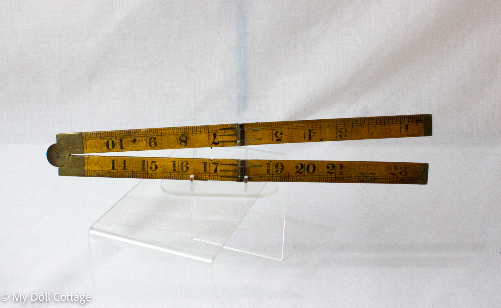 3. Fully extended 24-inch boxwood folding ruler with brass fittings and imperial graduations.