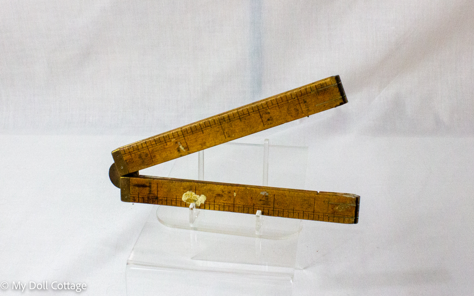 2. Reverse view of English-made wooden folding rule displaying aged timber surface and measurement markings.