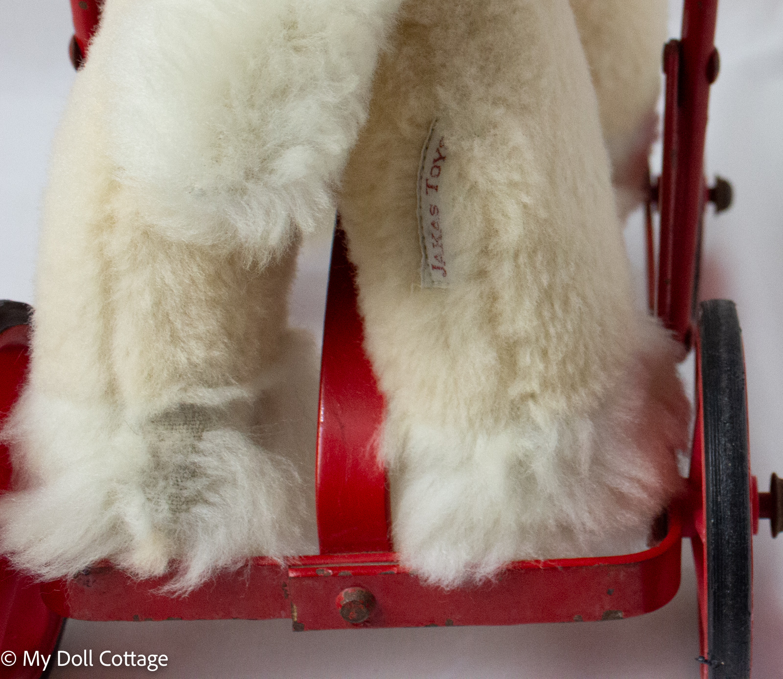 Close-up of Jakas Toys fabric tag on plush leg