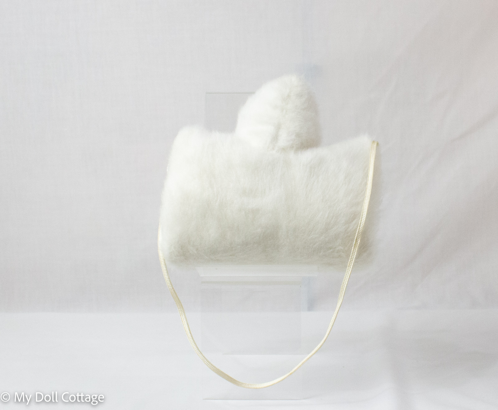 Rear view of muff showing plain faux fur backing