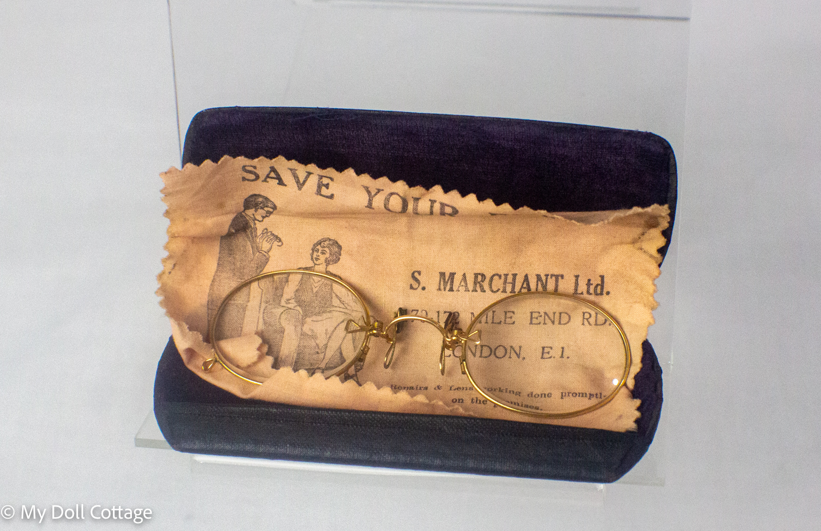 Original fitted spectacle case displaying the Edwardian rolled gold pince-nez spectacles together with the advertising cleaning cloth.