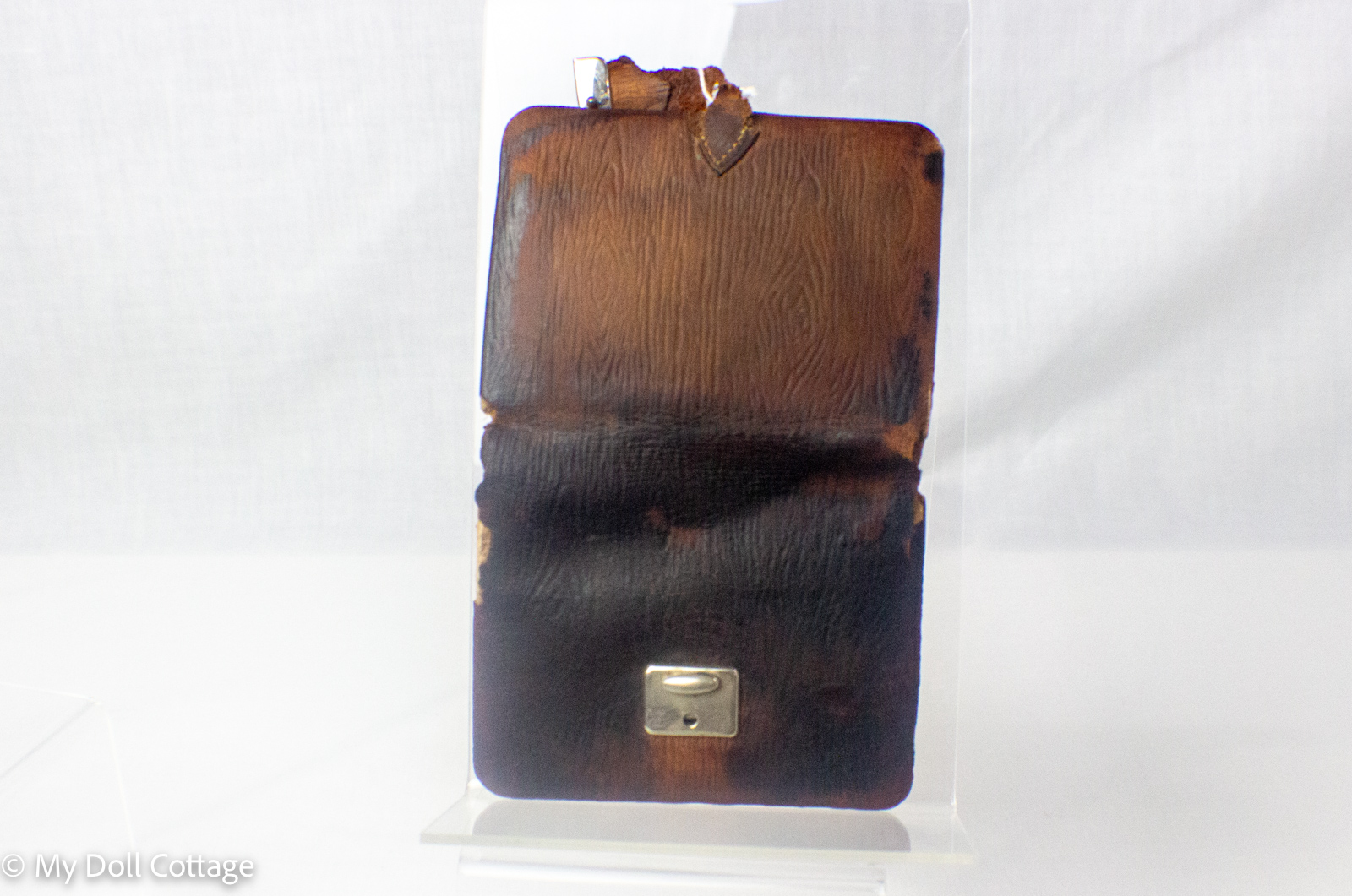 Open antique needle wallet displaying original labelled compartments containing assorted sewing and embroidery needles.