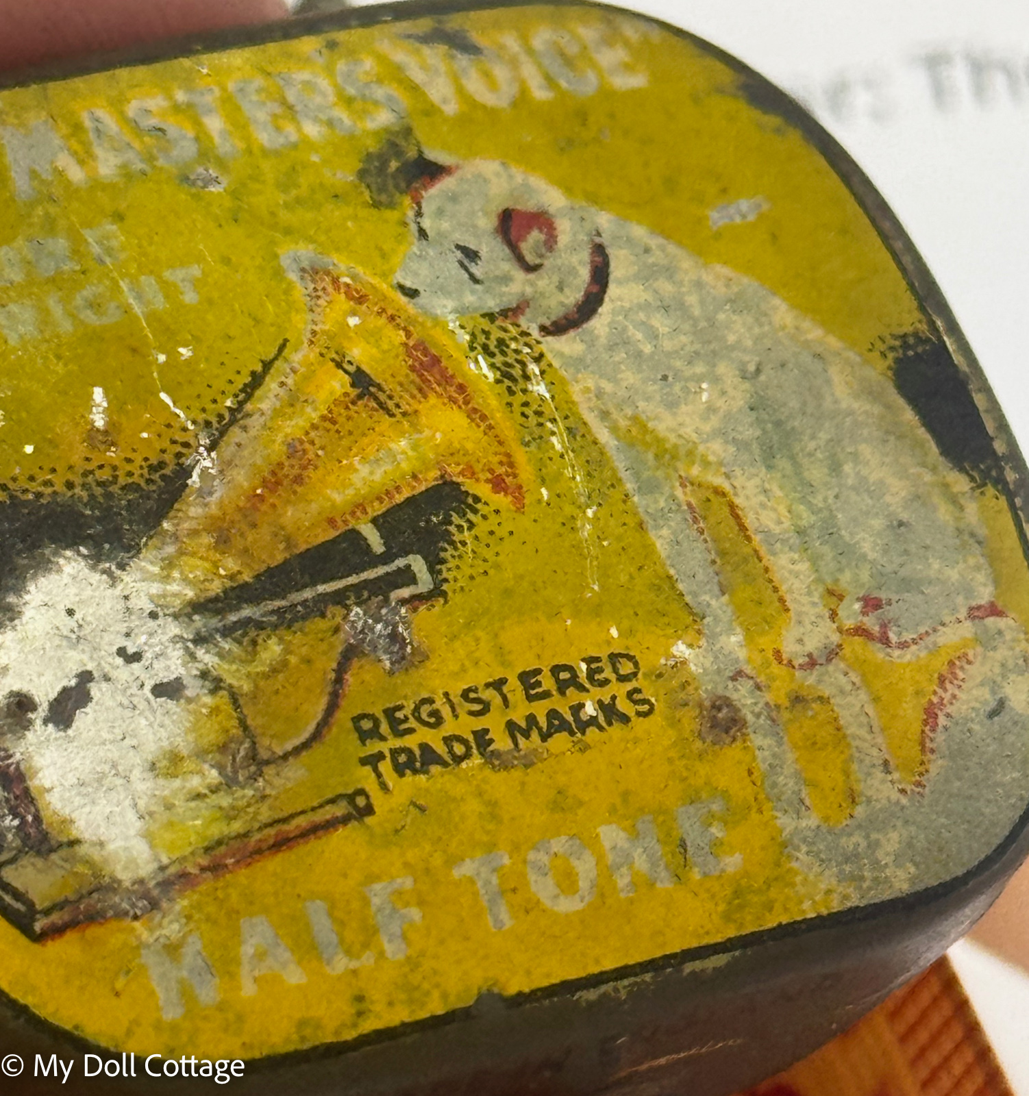 close up of Vintage His Master's Voice Half Tone gramophone needle tin showing the Nipper dog