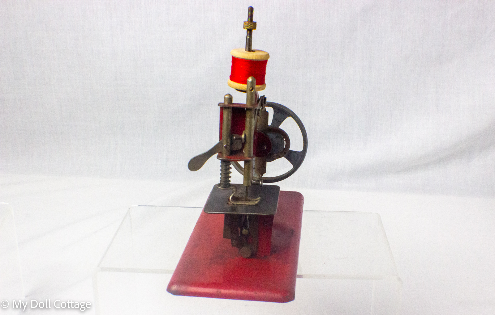 Rear view of the machine showing the flywheel and rear mechanism.
