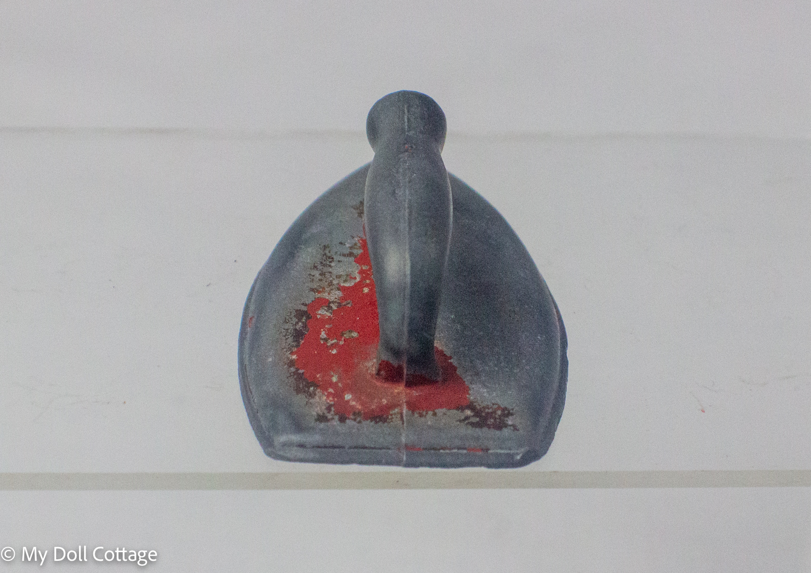 Rear angled view showing the integral handle and surviving original paint.
