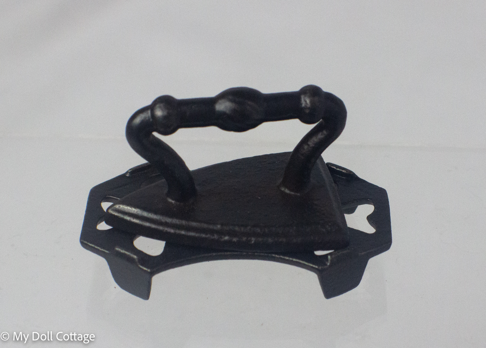 c.1900–1920 Miniature Cast Iron Sad Iron with Folding Trivet Stand
