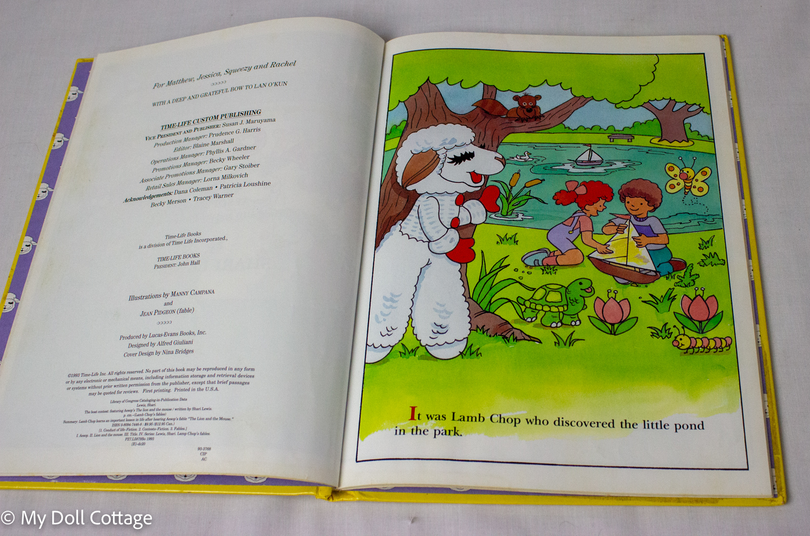 •	Open title page displaying publication information and colourful Lamb Chop illustration.
