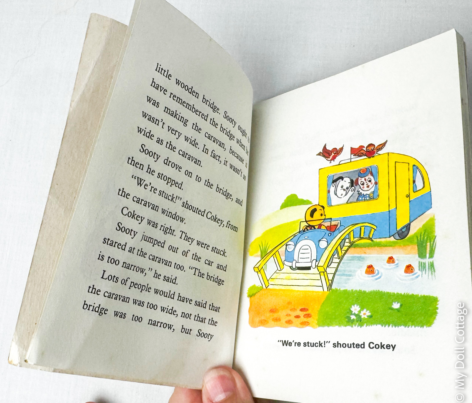 Interior pages of the 1982 Sooty’s Adventures book showing Sooty and colour illustrations of a steamroller and roadside scene.