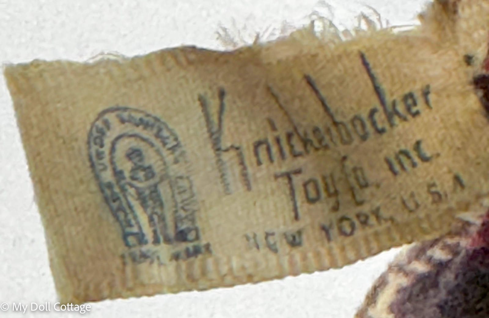 Detail of the original Humpty Dumpty fabric identification tag showing the 1955 copyright date and Made in U.S.A. marking.