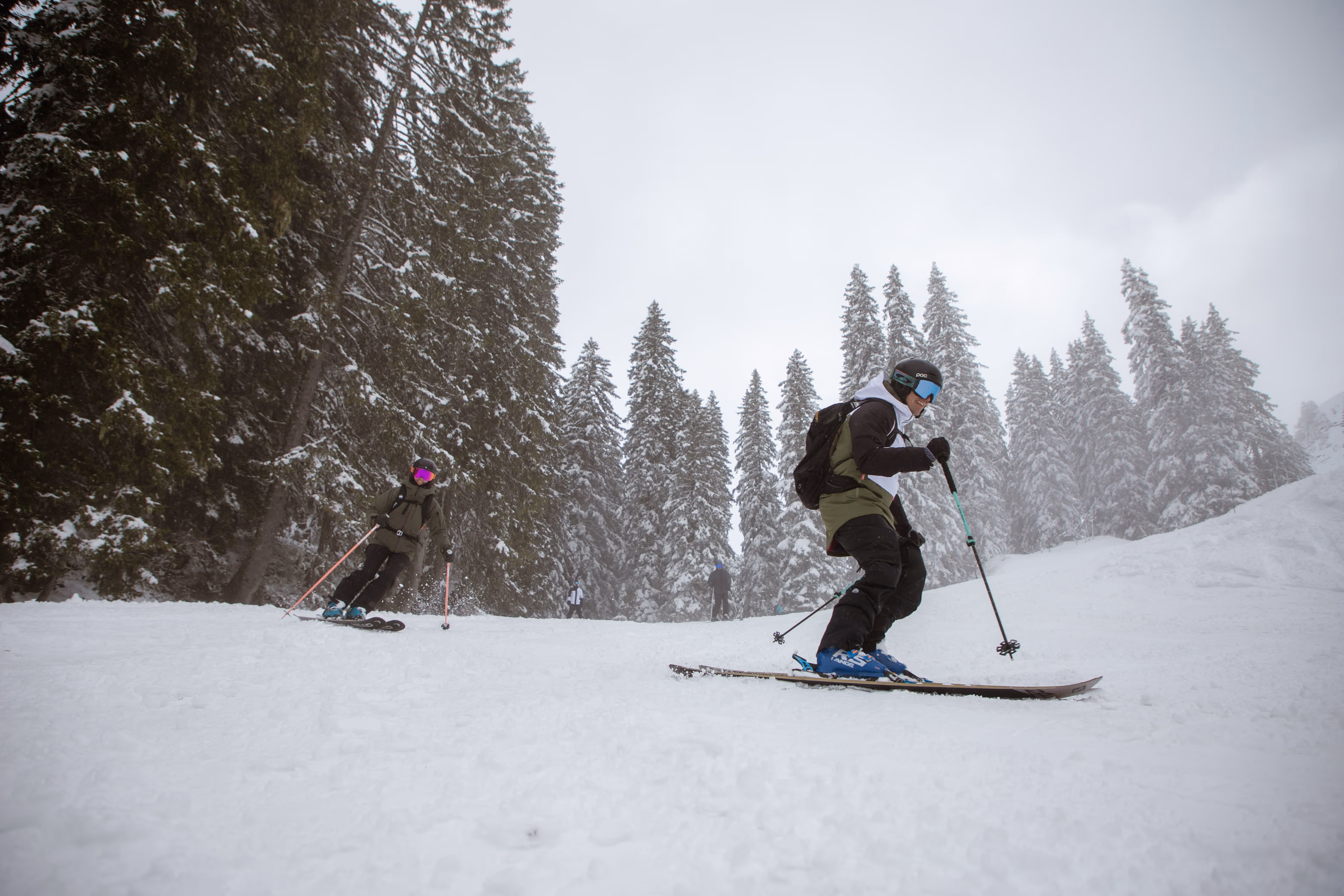 A Pulse ski instructor guiding a student through the trees in Morzine 