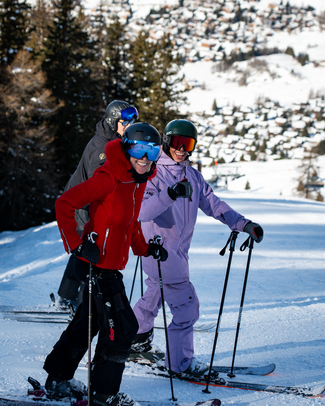 Family enjoying a private ski lesson with a Pulse Snowsports instructor in Verbier, learning together on the mountain.