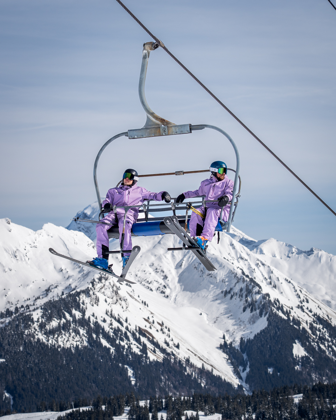 Pulse Snowsports coaches James Lockerbie and Cameron Skinner riding a chairlift in Morzine, France.