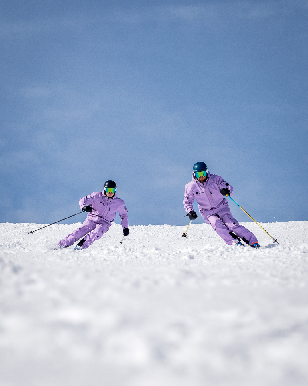 Pulse Snowsports BASI Level 4 ISTD instructors skiing together in Verbier during a winter training session.