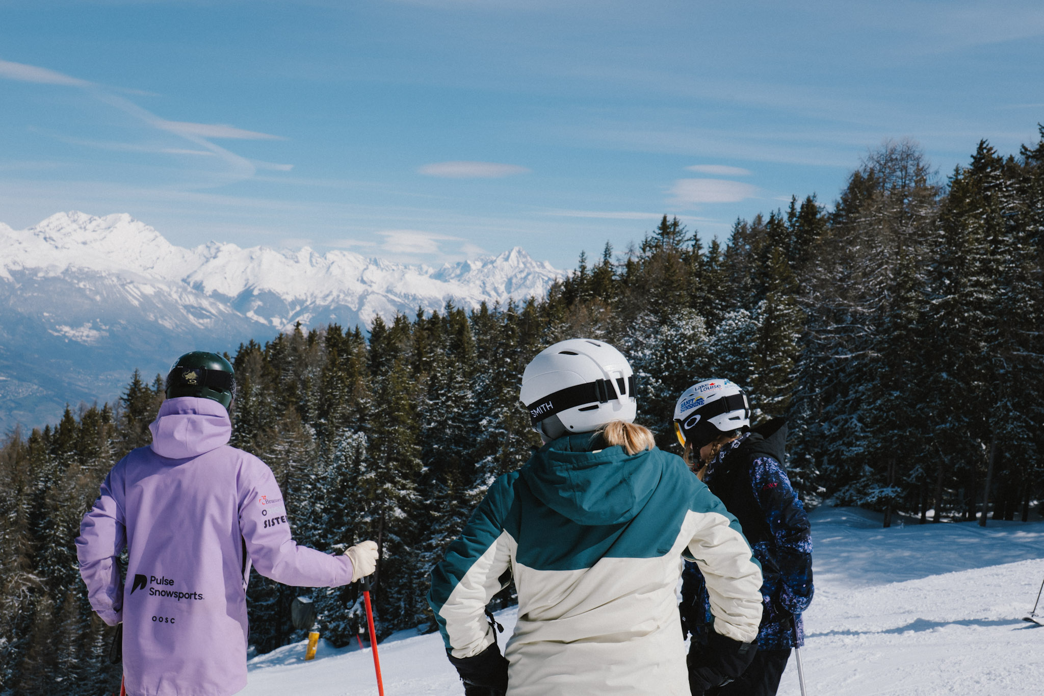 Family enjoying a private ski lesson with a Pulse Snowsports instructor in Verbier.