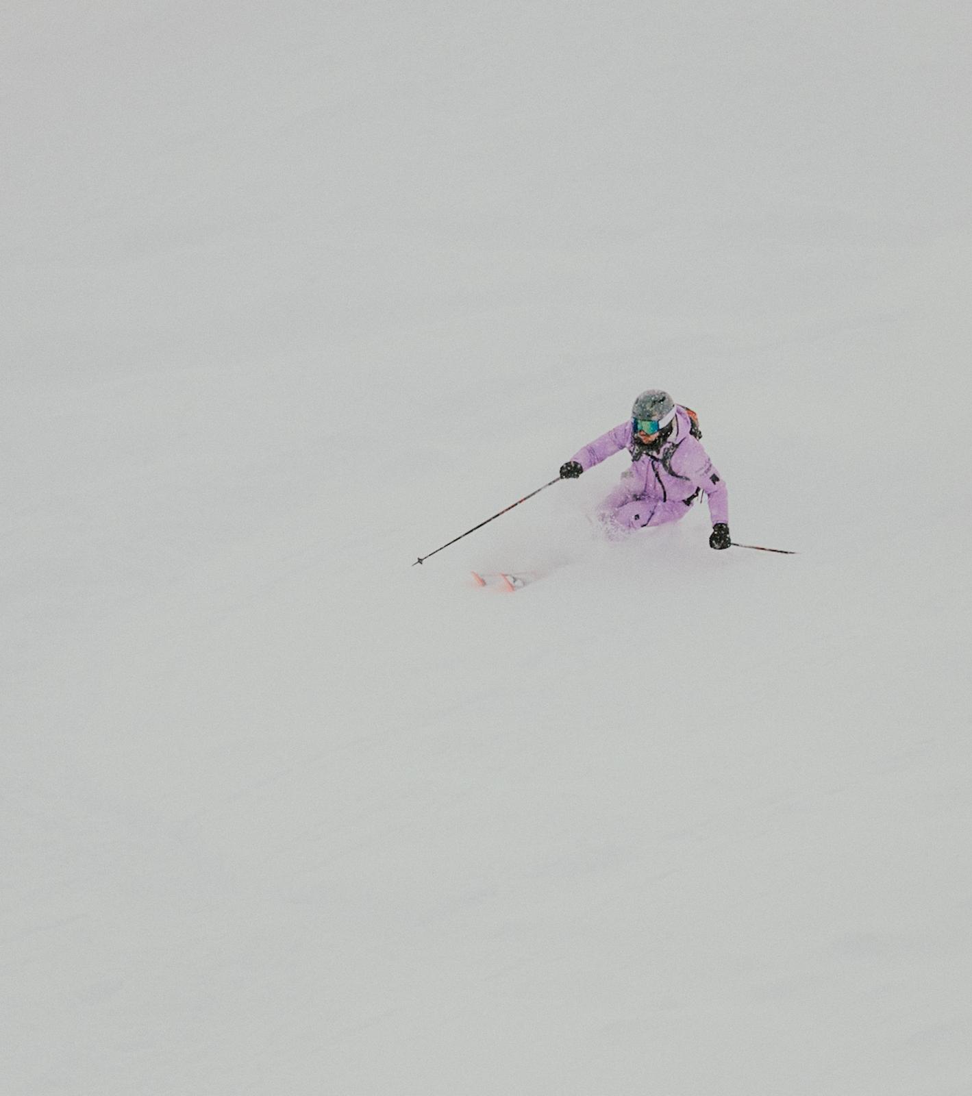 Sam Goodlass skiing fresh powder while coaching clients in Verbier.