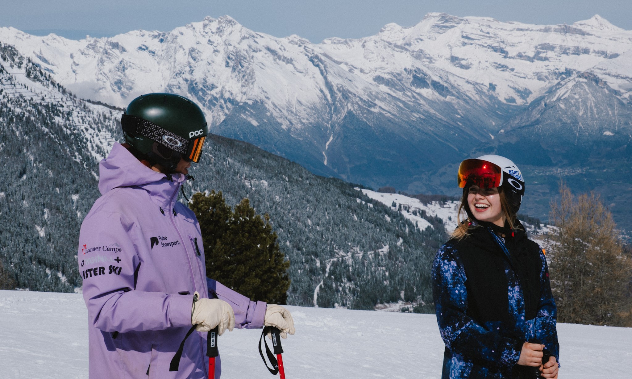 Smiling skier with their Pulse Snowsports instructor after a successful private ski lesson in Verbier.