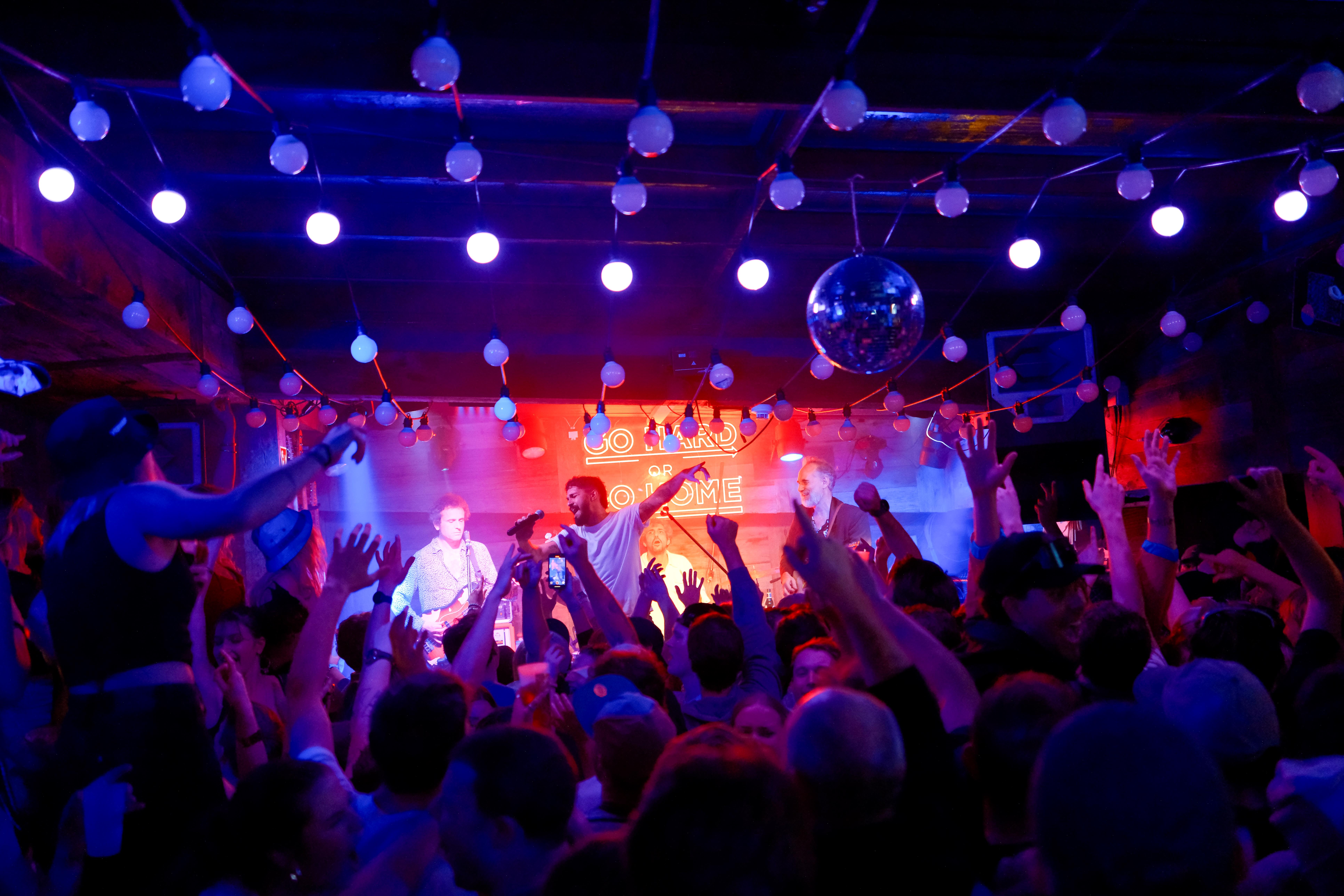 Après ski crowd dancing and enjoying live music at Farinet in Verbier.
