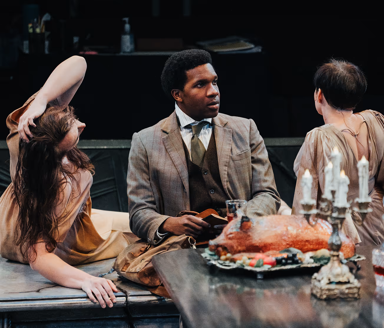 Actors Theatre cast in dramatic dinner scene, reflecting bold storytelling in Louisville theatre.