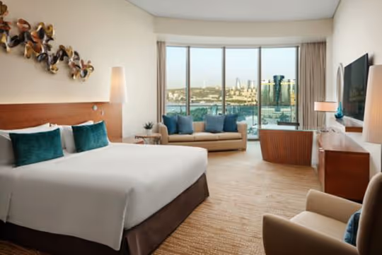 King bed, couch, tv, armchair, City View