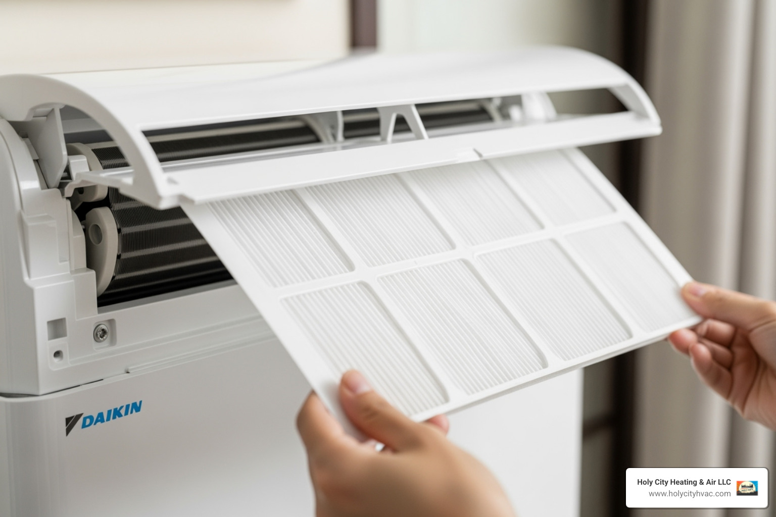 person easily sliding out a Daikin AC filter - daikin air conditioner maintenance