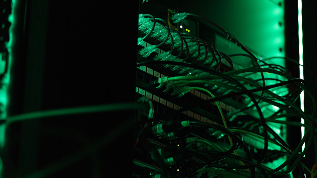 Technician inspecting server room cooling equipment to prevent hot spots and hardware failure