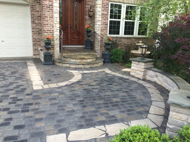 Travertine paver pool deck with turf strips