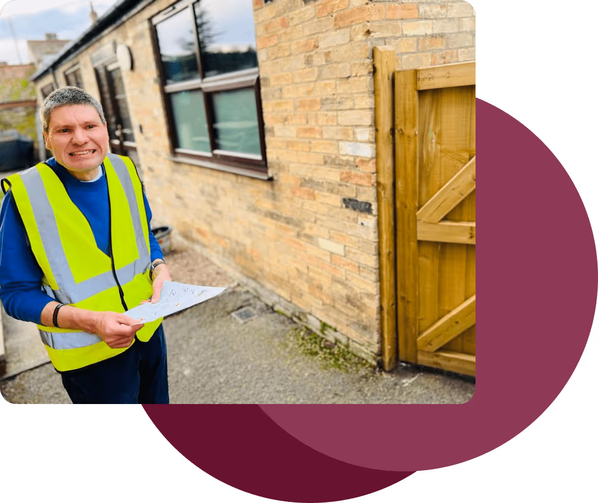 Service user outside with a clipboard