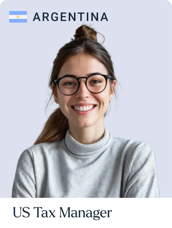 Smiling woman with glasses and a bun wearing a gray turtleneck under the Argentina flag and text saying US Tax Manager.